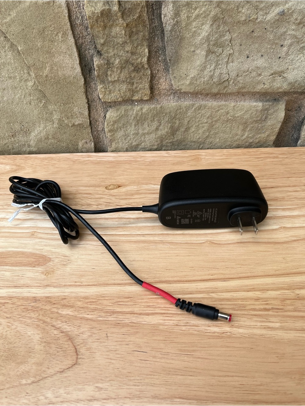 Black AC/DC Power Adapter with Red-Tipped DC Plug